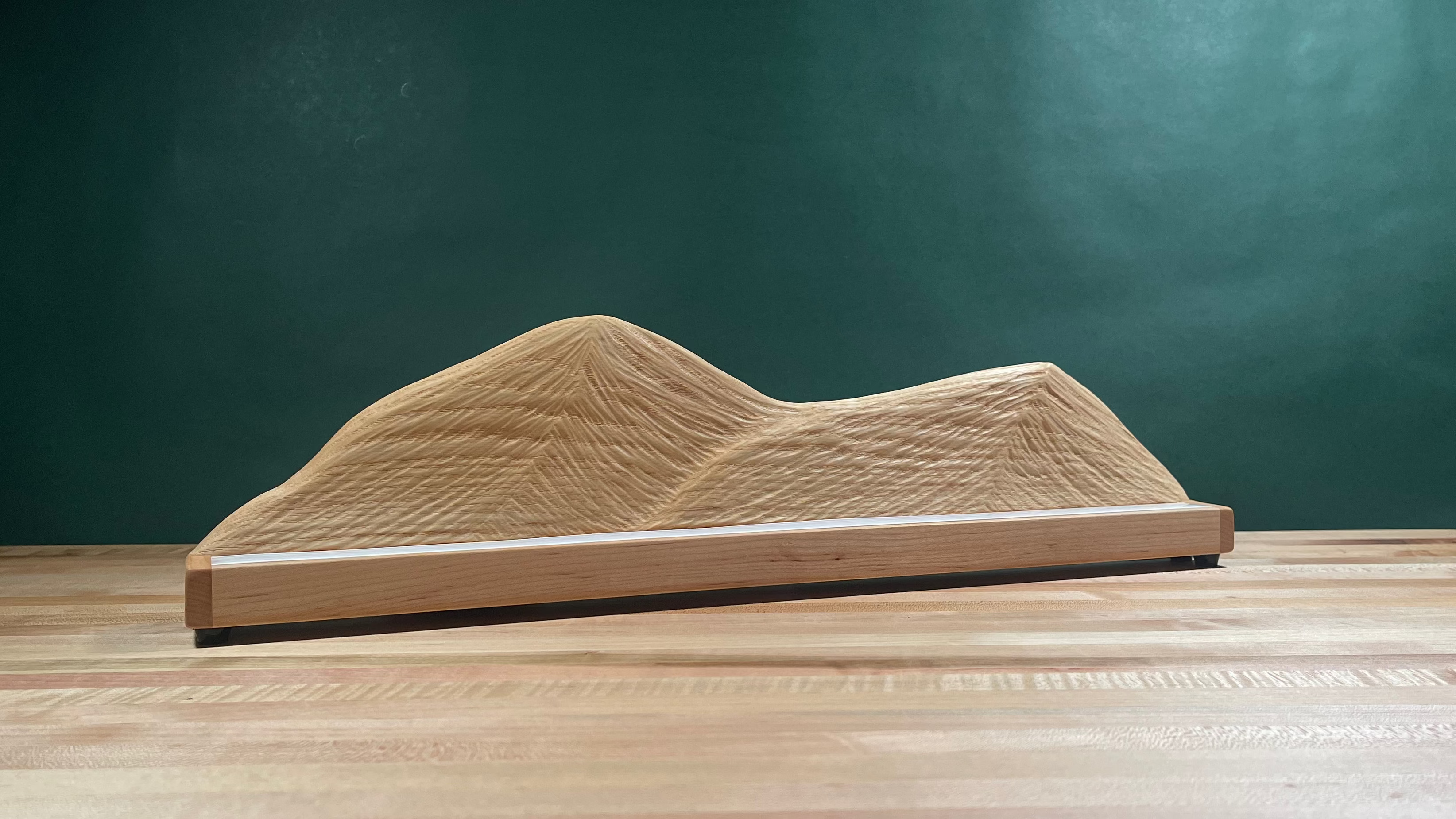 Wood carved mountain range with lighting turned off