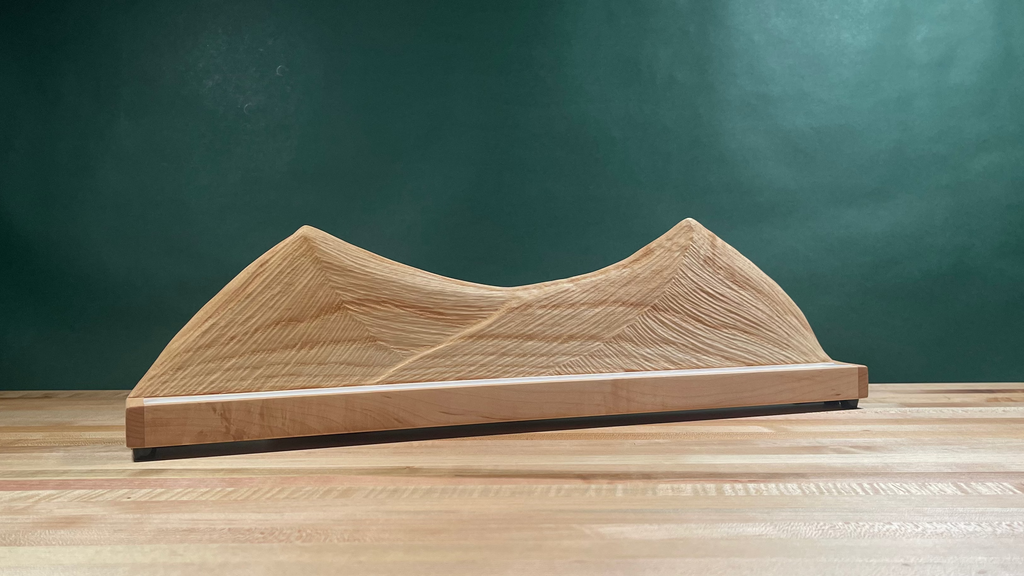 Wood carved mountain range with lighting turned off