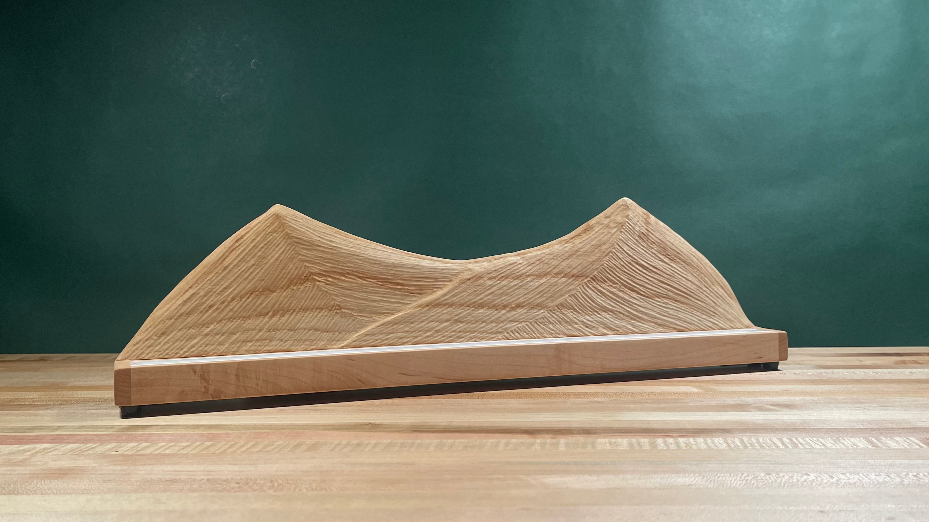 Wood carved mountain range with lighting turned off